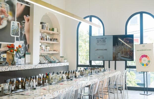 Perfume workshop room with a long bar table and arched windows at NOTE  The Scent Lab in Thao Dien