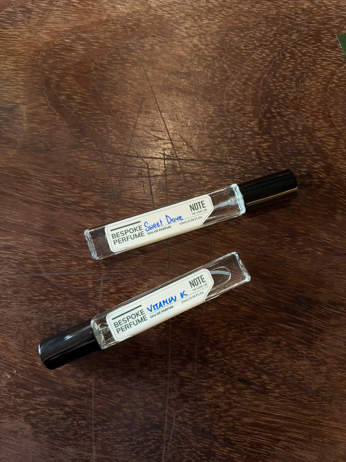 Two custom bespoke perfume bottles created at NOTE The Scent Lab perfume making workshop