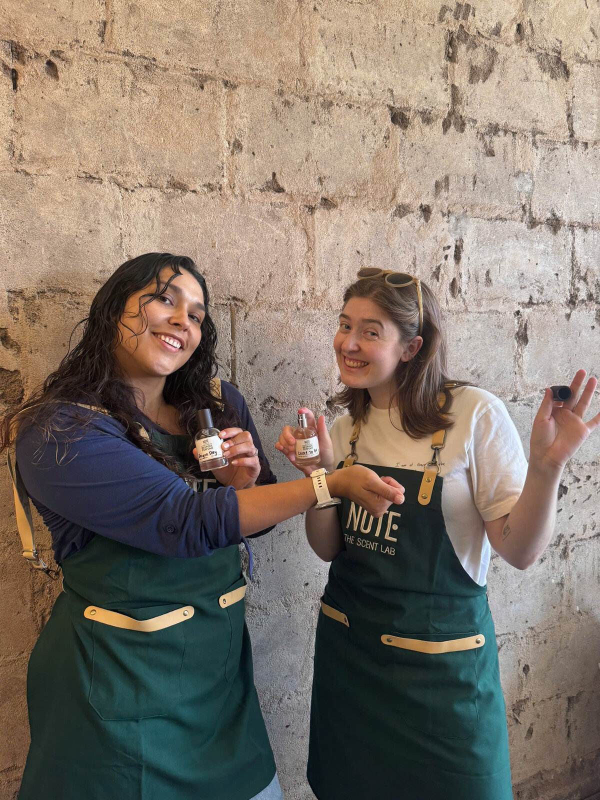 Friends showing custom perfume bottles Vietnam