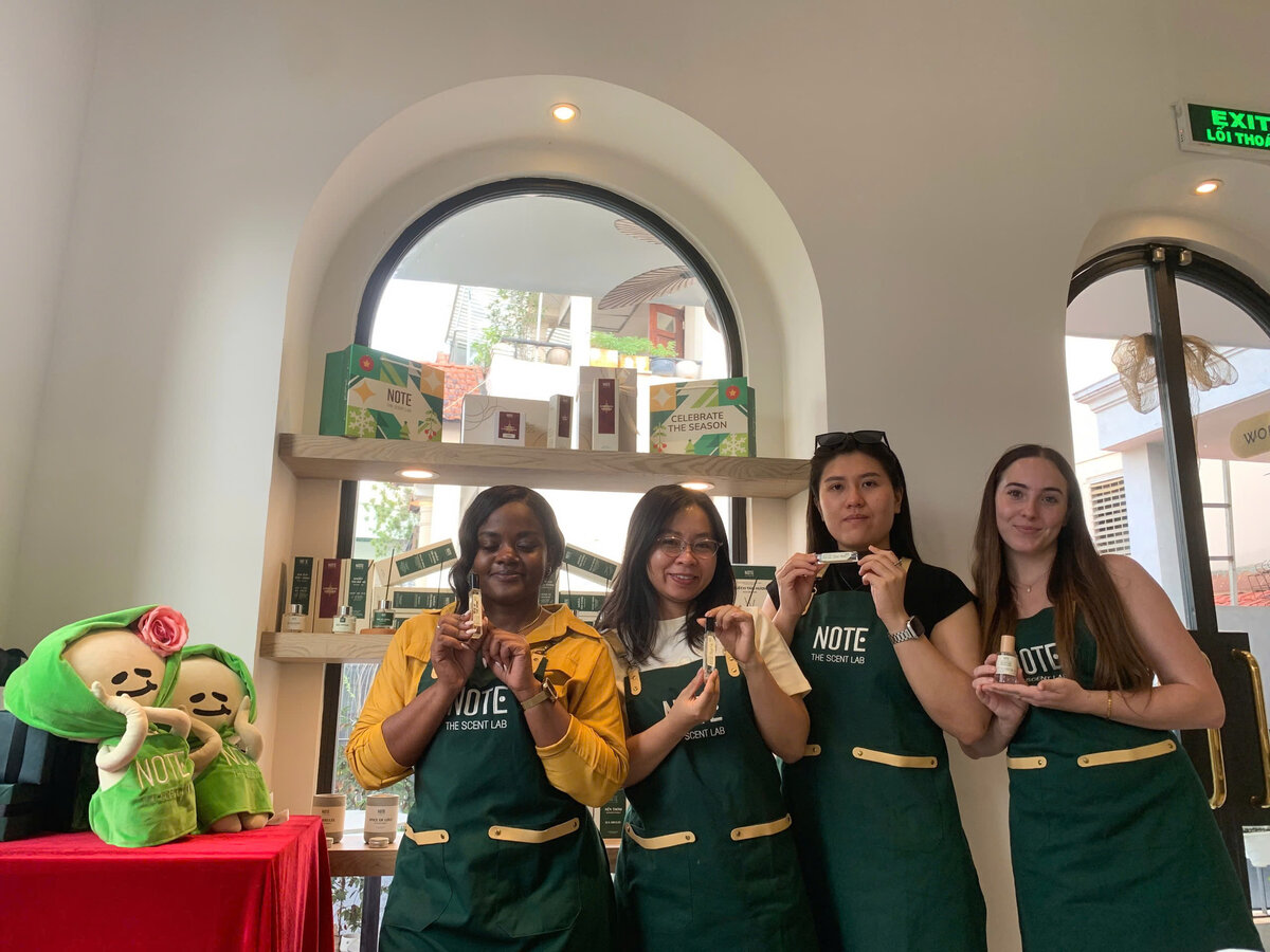 Group of first time Vietnam visitors at perfume making workshop  pre booked experience