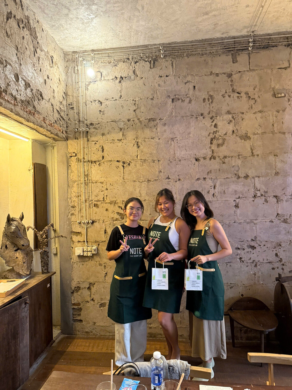 European slow traveller creating custom perfume at NOTE Hanoi Lotte Mall studio