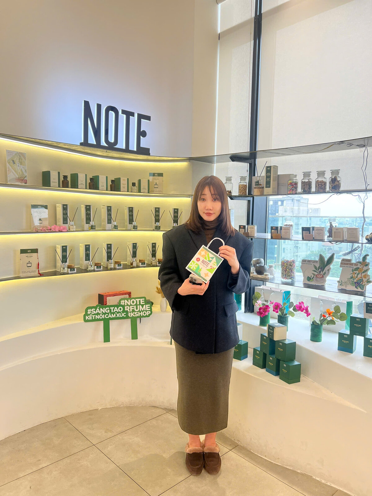 Saigon honeymoon couple blending custom perfume at NOTE Cafe Apartment