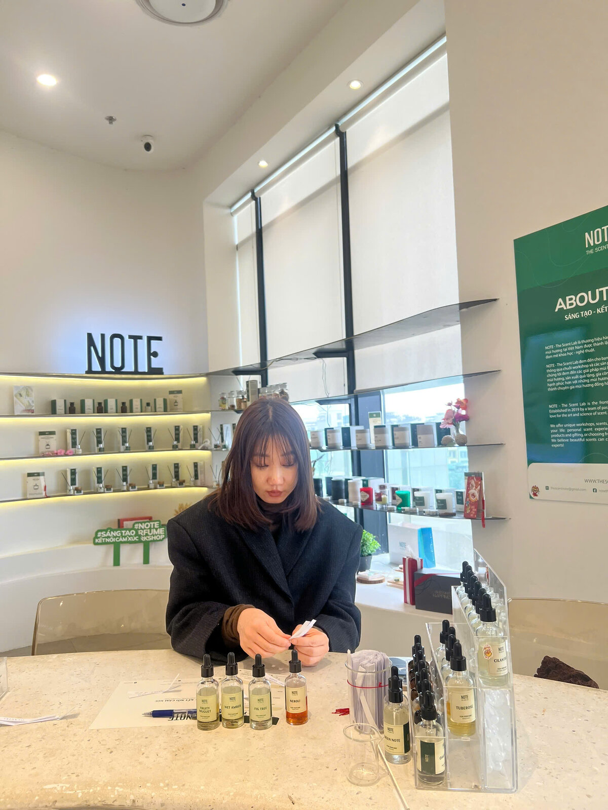 Couples perfume workshop Vietnam blending side by side at NOTE Saigon