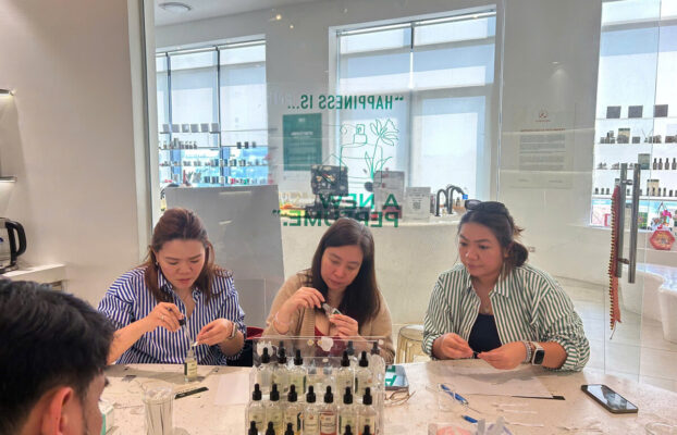 Travelers at pre booked perfume workshop in Lotte Mall Hanoi