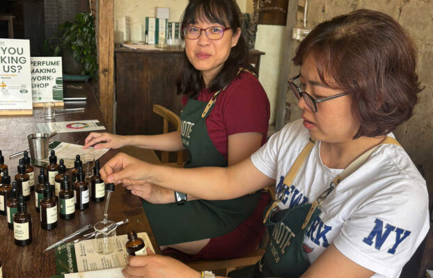 NOTE scent artist guiding visitor at Cafe Apartment perfume workshop District 1