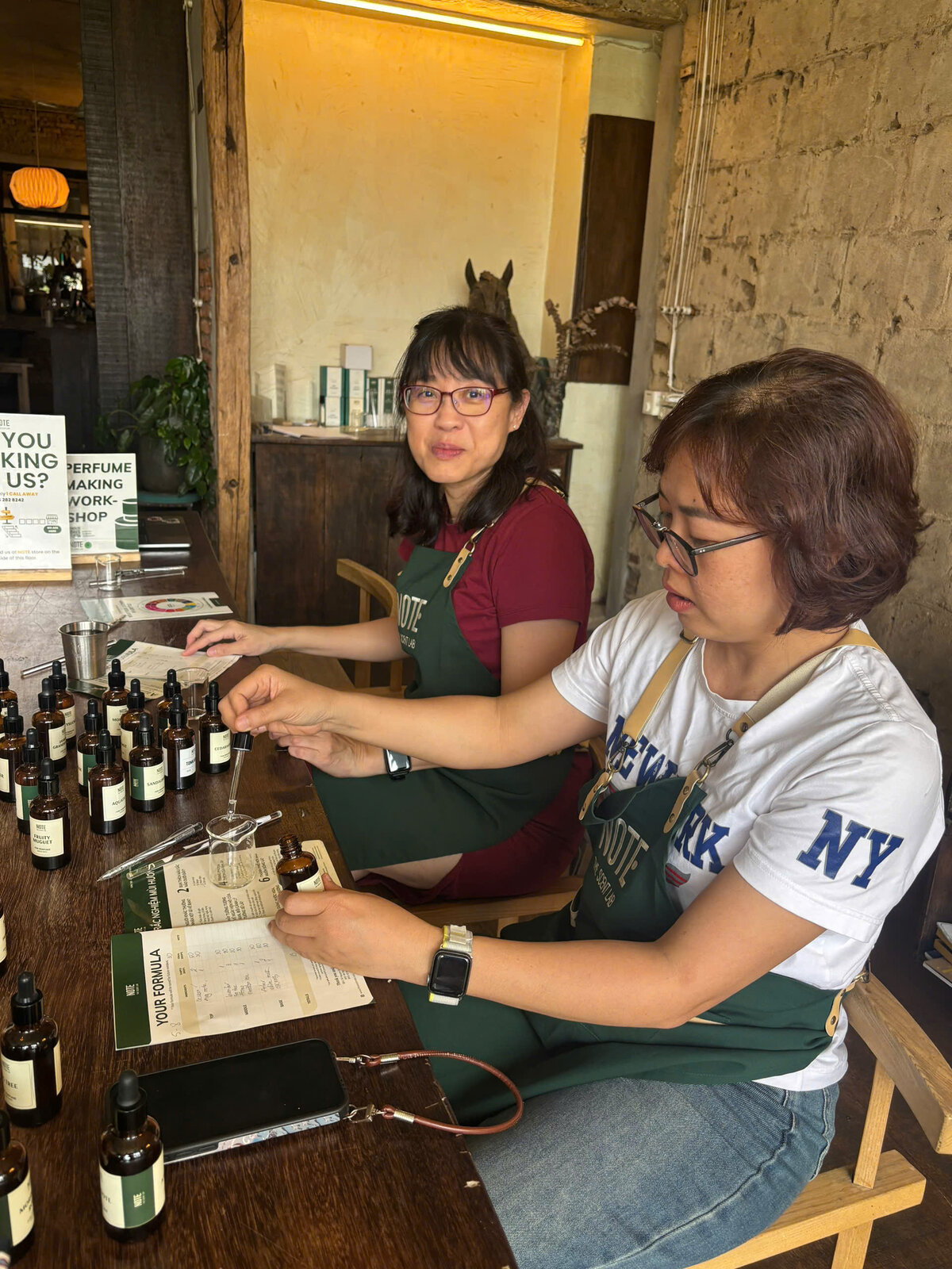 NOTE scent artist teaching perfume blending technique at workshop in Cafe Apartment Saigon