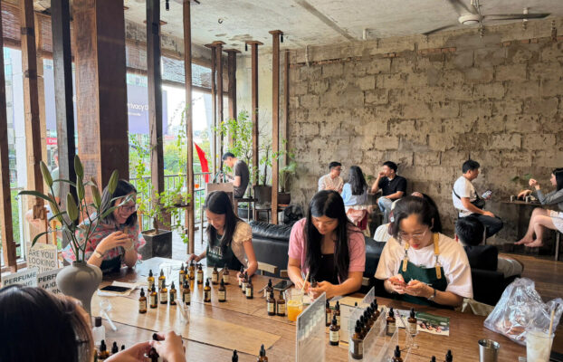 thingstodohcmcperfumeworkshopgroup Perfume Workshop by NOTE The Scent Lab Group of travelers creating custom perfume at NOTE workshop in Ho Chi Minh City