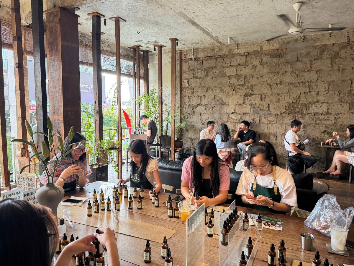 Group of travelers creating custom perfume at NOTE workshop in Ho Chi Minh City