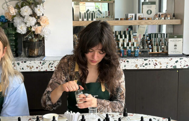Traveler blending unique souvenir perfume at NOTE workshop in Saigon