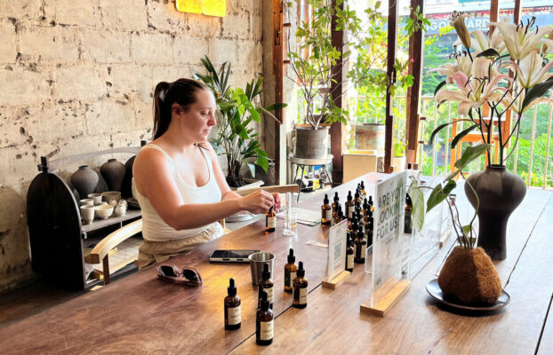 whattoexpectperfumeworkshopsoloblending Perfume Workshop by NOTE The Scent Lab Solo traveler blending perfume at NOTE workshop in Saigon Cafe Apartment