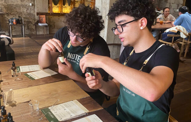 Young travelers blending perfume at NOTE workshop on their last day in Ho Chi Minh City